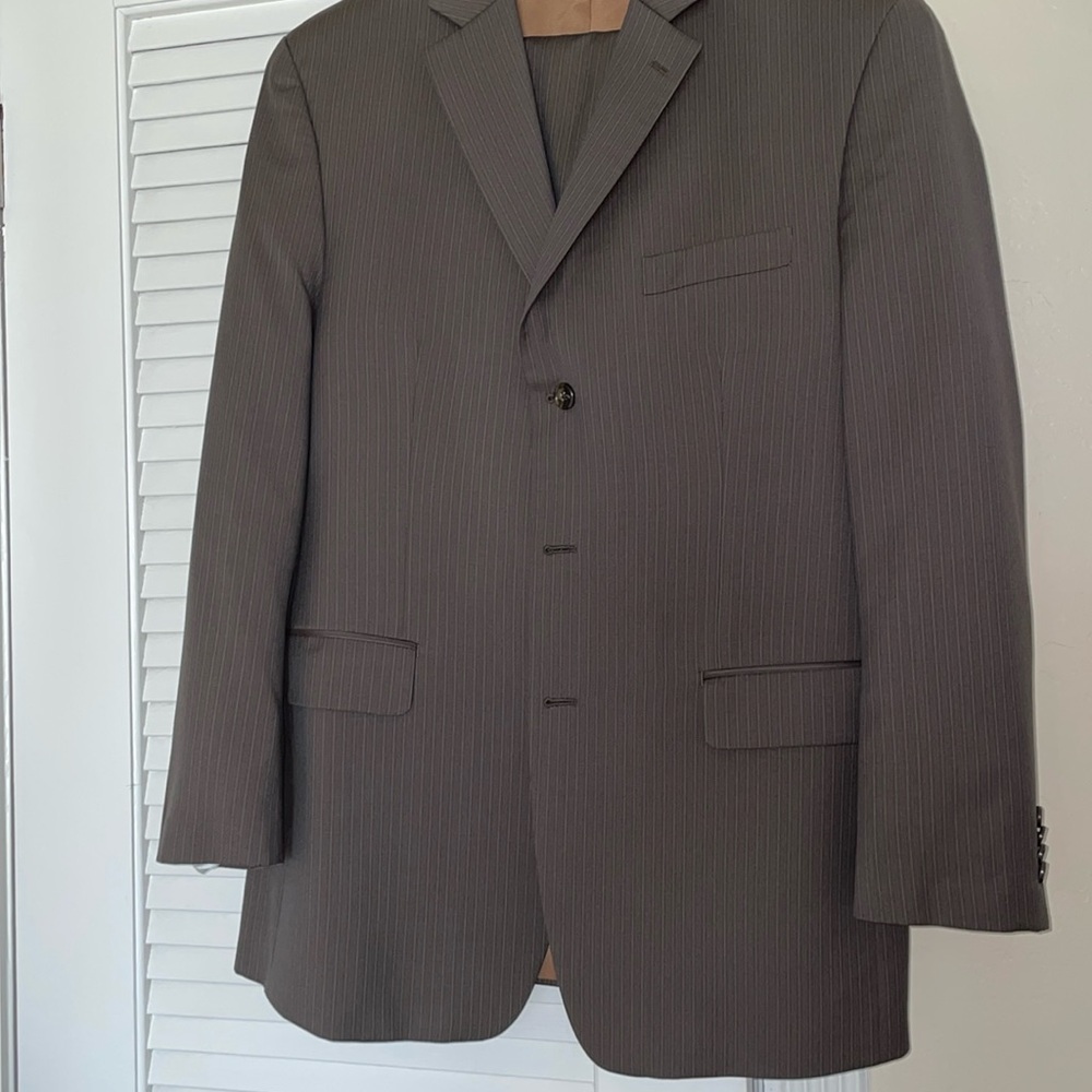 Michael Kors men’s pinstripe suit. Perfect condition. Worn less than five times.